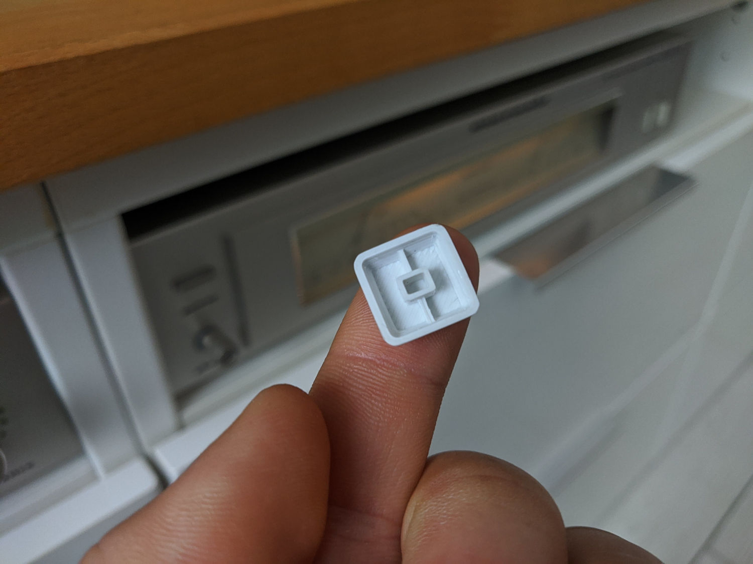 Back of the keycap with stem and it&rsquo;s reinforcement. It&rsquo;s a miniature keyboard keycap basically. So cute.